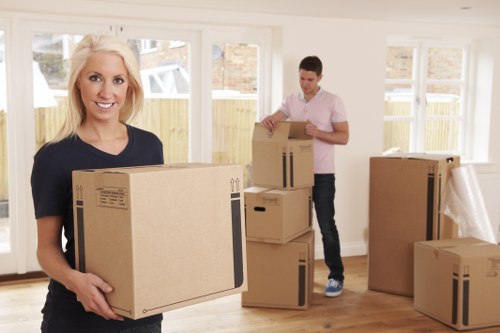 Packed moving boxes and furniture ready for transport in Woodlands