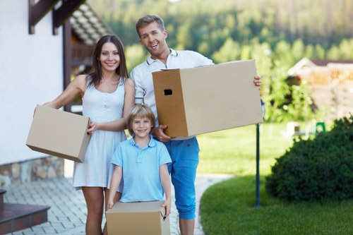 Professional movers handling furniture during house removals in Woodlands